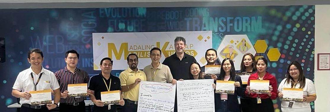 Aftermarket Inside Sales cohort holding training commitment certificates in Manila, Philippines